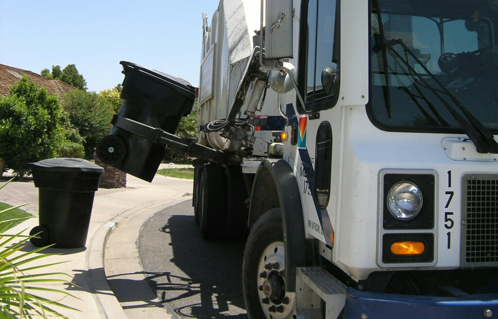 Garbage Truck Picking Up Trash Can